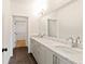 Stylish bathroom with double vanity, granite countertops, and modern fixtures at 686 Exchange Se St, Atlanta, GA 30315