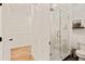 Modern bathroom featuring a glass-enclosed shower and a well-organized walk-in closet at 686 Exchange Se St, Atlanta, GA 30315