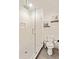 Contemporary bathroom with a glass shower, rain shower head, and floating shelves at 686 Exchange Se St, Atlanta, GA 30315