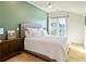 Inviting bedroom with a large window, modern ceiling fan, and neutral tones at 686 Exchange Se St, Atlanta, GA 30315