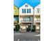 Three-story townhome featuring a private balcony, garage, and modern architectural details at 686 Exchange Se St, Atlanta, GA 30315