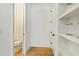 Hallway featuring a half bathroom, storage and shelving space at 686 Exchange Se St, Atlanta, GA 30315