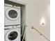 A convenient, stacked washer and dryer offers efficient laundry solutions in this home at 686 Exchange Se St, Atlanta, GA 30315