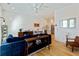 Open-concept living room showcasing hardwood floors, stylish decor, and kitchen access at 686 Exchange Se St, Atlanta, GA 30315