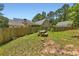 Private backyard with a wooden picnic table and a wooden fence that offers privacy for the property at 125 Murphy Creek Ln, Fayetteville, GA 30215