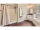Bathroom featuring a shower, soaking tub, hardwood floors, and marble countertops offering a spa-like experience at 125 Murphy Creek Ln, Fayetteville, GA 30215