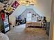 Spacious bedroom with unique slanted ceilings, decorated with school flags and a cozy vibe at 125 Murphy Creek Ln, Fayetteville, GA 30215
