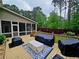 Outdoor deck with furniture covers and a view of the landscaped backyard at 125 Murphy Creek Ln, Fayetteville, GA 30215