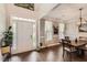 Elegant dining room featuring hardwood floors, a modern chandelier, and ample natural light at 125 Murphy Creek Ln, Fayetteville, GA 30215