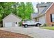 Long driveway leads to a detached garage, providing ample parking space at 125 Murphy Creek Ln, Fayetteville, GA 30215