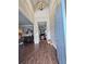 Welcoming foyer boasts hardwood floors, soaring ceilings, and an elegant light fixture at 125 Murphy Creek Ln, Fayetteville, GA 30215