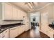 Functional kitchen with white cabinetry, dark countertops, and seamless transition to the dining area at 125 Murphy Creek Ln, Fayetteville, GA 30215
