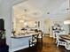 Well-lit kitchen with granite countertops, white cabinetry, a breakfast bar, and a separate coffee bar at 125 Murphy Creek Ln, Fayetteville, GA 30215