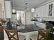 Bright kitchen features granite countertops, white cabinetry, and stainless steel appliances at 125 Murphy Creek Ln, Fayetteville, GA 30215