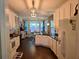 Bright kitchen features white cabinets, dark countertops, pendant lighting and breakfast nook at 125 Murphy Creek Ln, Fayetteville, GA 30215