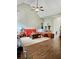 Open-concept living room featuring hardwood floors, a vaulted ceiling, and natural light at 125 Murphy Creek Ln, Fayetteville, GA 30215