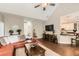 Bright living room features vaulted ceilings and an open layout with hardwood floors that connects to the kitchen at 125 Murphy Creek Ln, Fayetteville, GA 30215