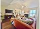 Spacious living room features a fireplace, large windows, and open access to the kitchen at 125 Murphy Creek Ln, Fayetteville, GA 30215