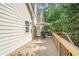 Relaxing deck area with outdoor seating, umbrella, and serene backyard view at 1495 Old Hunters Lake Dr, Marietta, GA 30062