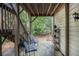 Back patio with seating, garden accents, and view of private wooded yard at 1495 Old Hunters Lake Dr, Marietta, GA 30062