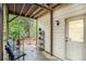 Back patio with seating, garden accents, and view of private wooded yard at 1495 Old Hunters Lake Dr, Marietta, GA 30062