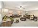 Finished basement with neutral carpet, drop ceiling, recessed lights, ceiling fan, and comfortable seating at 1495 Old Hunters Lake Dr, Marietta, GA 30062