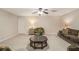 Finished basement with neutral carpet, drop ceiling, recessed lights, ceiling fan, and comfortable seating at 1495 Old Hunters Lake Dr, Marietta, GA 30062