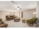 Finished basement with neutral carpet, drop ceiling, recessed lights, ceiling fan, and comfortable seating at 1495 Old Hunters Lake Dr, Marietta, GA 30062