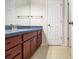 Bathroom with a wood vanity, tiled floors, and a view of the doorways at 1495 Old Hunters Lake Dr, Marietta, GA 30062