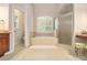 Bathroom features a large bathtub and walk-in shower at 1495 Old Hunters Lake Dr, Marietta, GA 30062