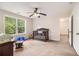 Comfortable bedroom featuring window, ceiling fan, and a toddler crib and rocking horse at 1495 Old Hunters Lake Dr, Marietta, GA 30062
