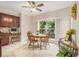 Bright breakfast nook with corner window, tile floors, with seating for four and ample natural light at 1495 Old Hunters Lake Dr, Marietta, GA 30062