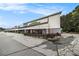 Commercial building featuring retail and restaurant spaces with outdoor patio at 1495 Old Hunters Lake Dr, Marietta, GA 30062