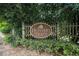 Community entrance sign featuring a vintage aesthetic and established landscaping at 1495 Old Hunters Lake Dr, Marietta, GA 30062