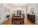Formal dining room with hardwood floors, chandelier, white shutters, and space to entertain at 1495 Old Hunters Lake Dr, Marietta, GA 30062