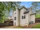 Back exterior elevation view with deck, fenced yard, and tan siding at 1495 Old Hunters Lake Dr, Marietta, GA 30062