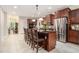 Open kitchen features a granite island with seating and stainless steel appliances at 1495 Old Hunters Lake Dr, Marietta, GA 30062