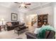 Spacious living room with coffered ceiling, leather seating, and access to the staircase at 1495 Old Hunters Lake Dr, Marietta, GA 30062