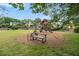 Community playground with seating for parents and a wooden playset at 1495 Old Hunters Lake Dr, Marietta, GA 30062
