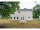 Exterior view of a two-story home with vinyl siding and backyard patio at 3230 Deer Valley Nw Dr, Acworth, GA 30101
