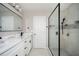 Modern bathroom with double vanity, matte black hardware, and tiled shower at 3230 Deer Valley Nw Dr, Acworth, GA 30101