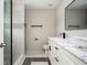 Modern bathroom features a glass enclosed shower, tile floors, and a white vanity at 3230 Deer Valley Nw Dr, Acworth, GA 30101