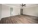 Bedroom featuring grey walls and dark brown hardwood flooring with two doorways at 3230 Deer Valley Nw Dr, Acworth, GA 30101