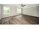 Spacious bedroom boasts natural light and hardwood floors at 3230 Deer Valley Nw Dr, Acworth, GA 30101