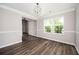 Dining room with dark laminate floors and a large window at 3230 Deer Valley Nw Dr, Acworth, GA 30101