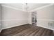 Formal dining room featuring hardwood floors, chair rail, crown molding and contemporary chandelier at 3230 Deer Valley Nw Dr, Acworth, GA 30101