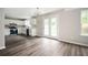 Open floor plan features a modern kitchen with stainless appliances and a dining area with door to the outside at 3230 Deer Valley Nw Dr, Acworth, GA 30101