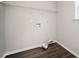 Empty laundry room with wood flooring and shelving at 3230 Deer Valley Nw Dr, Acworth, GA 30101