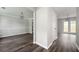 A living room featuring hardwood floors, decorative lighting and open access to backyard and dining area at 3230 Deer Valley Nw Dr, Acworth, GA 30101