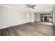 Large living room features grey walls and dark brown hardwood flooring with views of the kitchen at 3230 Deer Valley Nw Dr, Acworth, GA 30101